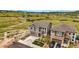 Beautiful two-story home featuring a well-manicured front yard, driveway, and a picturesque mountain view in the background at 2511 Loon Ln, Castle Rock, CO 80104