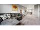 Inviting living room with plush seating, soft carpet, and view of the upstairs hallway and stairwell at 2511 Loon Ln, Castle Rock, CO 80104