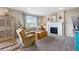 Inviting living room with a cozy fireplace, plush seating, and a decorative mirror and sconces at 2511 Loon Ln, Castle Rock, CO 80104