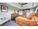 A well-decorated main bedroom with a decorative chair, sliding doors, and a neutral color palette at 2511 Loon Ln, Castle Rock, CO 80104