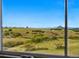 Breathtaking view of rolling hills and open spaces, framed by a window, inviting nature indoors at 2511 Loon Ln, Castle Rock, CO 80104