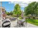 A delightful backyard features a patio with comfortable seating, perfect for entertaining or relaxing outdoors at 17020 E 107Th Ave, Commerce City, CO 80022