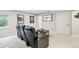 Basement home theater with recliner seating and neutral carpet at 17020 E 107Th Ave, Commerce City, CO 80022