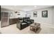 Finished basement with home theater seating, kitchenette, and movie decor at 17020 E 107Th Ave, Commerce City, CO 80022