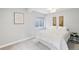 Bright bedroom with white linen and soft lighting at 17020 E 107Th Ave, Commerce City, CO 80022
