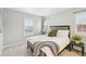 Neutral bedroom features large windows, carpeted floor, and decor at 17020 E 107Th Ave, Commerce City, CO 80022