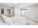 Bright bedroom featuring a large window and neutral decor at 17020 E 107Th Ave, Commerce City, CO 80022