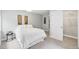 Light bedroom with white bedding, a closet, and stylish decor at 17020 E 107Th Ave, Commerce City, CO 80022