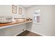 Clean laundry room features a folding counter, decor, and a window at 17020 E 107Th Ave, Commerce City, CO 80022