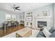 Bright living room with hardwood floors, fireplace and neutral paint at 17020 E 107Th Ave, Commerce City, CO 80022