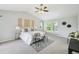 Spacious main bedroom featuring vaulted ceilings and a ceiling fan at 17020 E 107Th Ave, Commerce City, CO 80022