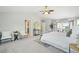 Bright main bedroom with french door balcony access and natural light at 17020 E 107Th Ave, Commerce City, CO 80022