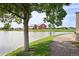 Scenic view of a pond and trail with a red barn in the background, showcasing the neighborhood's beauty at 17020 E 107Th Ave, Commerce City, CO 80022