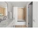 Bright bathroom with a tub/shower combo, tile surround, neutral paint, modern sink and vanity at 22580 E Ontario Dr # 204, Aurora, CO 80016