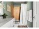Cozy bathroom featuring a tiled shower, white vanity, and a fresh, neutral color scheme at 22580 E Ontario Dr # 204, Aurora, CO 80016