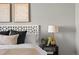 Stylish bedroom featuring a bedside table lamp and sophisticated decor creating a calming retreat at 22580 E Ontario Dr # 204, Aurora, CO 80016