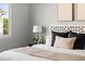 Bright bedroom with a comfortable bed, stylish headboard, and serene decor for relaxation at 22580 E Ontario Dr # 204, Aurora, CO 80016