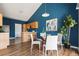 Modern kitchen and dining area with stainless steel appliances, wood cabinets, and cozy seating at 22580 E Ontario Dr # 204, Aurora, CO 80016