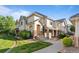 Charming townhome features a well-maintained lawn, stone accents and a private entrance, offering comfortable living at 22580 E Ontario Dr # 204, Aurora, CO 80016