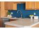 Kitchen with tile countertops, stainless steel dishwasher, and a double stainless sink at 22580 E Ontario Dr # 204, Aurora, CO 80016