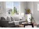 Bright living room features a comfortable gray sofa, large window, and stylish decor at 22580 E Ontario Dr # 204, Aurora, CO 80016
