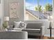 Well-lit living room with a cozy sofa, natural light, and stylish decorative accents at 22580 E Ontario Dr # 204, Aurora, CO 80016