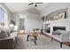 Spacious living room with vaulted ceiling, fireplace, and modern gray seating arrangement at 22580 E Ontario Dr # 204, Aurora, CO 80016