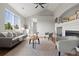 Spacious living room with vaulted ceiling, comfortable gray seating, and a fireplace at 22580 E Ontario Dr # 204, Aurora, CO 80016