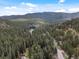 Stunning aerial view of wooded area, perfect for outdoor enthusiasts and nature lovers at 28272 Shadow Mountain Dr, Conifer, CO 80433