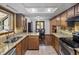 A well-equipped kitchen featuring stainless appliances and granite countertops at 28272 Shadow Mountain Dr, Conifer, CO 80433
