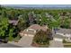 Beautiful home with a two car garage, mature trees and solar panels, with mountain views in the background at 8043 S Zephyr St, Littleton, CO 80128
