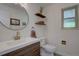 Stylish powder room featuring a modern vanity with white countertop and patterned floor at 8043 S Zephyr St, Littleton, CO 80128
