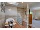 Luxurious bathroom featuring a soaking tub, walk-in shower, and skylight at 8043 S Zephyr St, Littleton, CO 80128