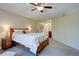 Comfortable bedroom with a ceiling fan and classic wooden furniture at 8043 S Zephyr St, Littleton, CO 80128