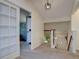 Hallway with stairs, plant and doorways to other rooms, creating an inviting atmosphere at 8043 S Zephyr St, Littleton, CO 80128