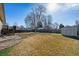 A spacious backyard features a utility shed, concrete patio, and wood fence at 1231 Missouri Ave, Longmont, CO 80501