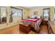 Cozy bedroom with hardwood floors, a comfortable bed, and ample natural light at 1231 Missouri Ave, Longmont, CO 80501