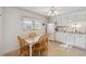 Well-lit kitchen featuring breakfast nook with view to the exterior at 1231 Missouri Ave, Longmont, CO 80501