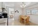 Bright kitchen and breakfast nook featuring wooden table and chairs at 1231 Missouri Ave, Longmont, CO 80501