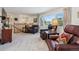 Inviting living area with plush seating and an open staircase at 1231 Missouri Ave, Longmont, CO 80501