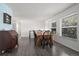 Bright dining room featuring large windows and hardwood floors, perfect for Gathering meals at 16933 E Bethany Pl, Aurora, CO 80013