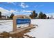 Eldorado Park sign surrounded by snow, showcasing the park's name and logo under a blue sky at 16933 E Bethany Pl, Aurora, CO 80013