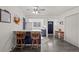 Open-concept kitchenette with breakfast bar and sleek, dark vinyl flooring at 16933 E Bethany Pl, Aurora, CO 80013