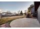 A spacious, well-maintained yard with a concrete pad and easy access to the house from the lighted stairwell at 18200 E Asbury Pl, Aurora, CO 80013
