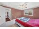 Comfortable bedroom featuring a ceiling fan and natural light from the window at 18200 E Asbury Pl, Aurora, CO 80013