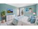 Comfortable bedroom with blue walls, white dresser, and beach themed decor at 18200 E Asbury Pl, Aurora, CO 80013