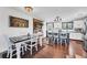 Bright dining area with a wooden accent wall, connecting to the kitchen and living areas at 18200 E Asbury Pl, Aurora, CO 80013