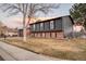 Charming home with a well-manicured front yard and attached garage, showcasing a welcoming exterior at 18200 E Asbury Pl, Aurora, CO 80013
