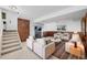 Inviting living room with stone fireplace and wood paneling at 18200 E Asbury Pl, Aurora, CO 80013
