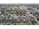 High aerial shot displaying a neighborhood of closely arranged houses with well-kept lawns at 4540 Crestone Peak St, Brighton, CO 80601